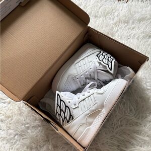 White Sneakers with Wing Design